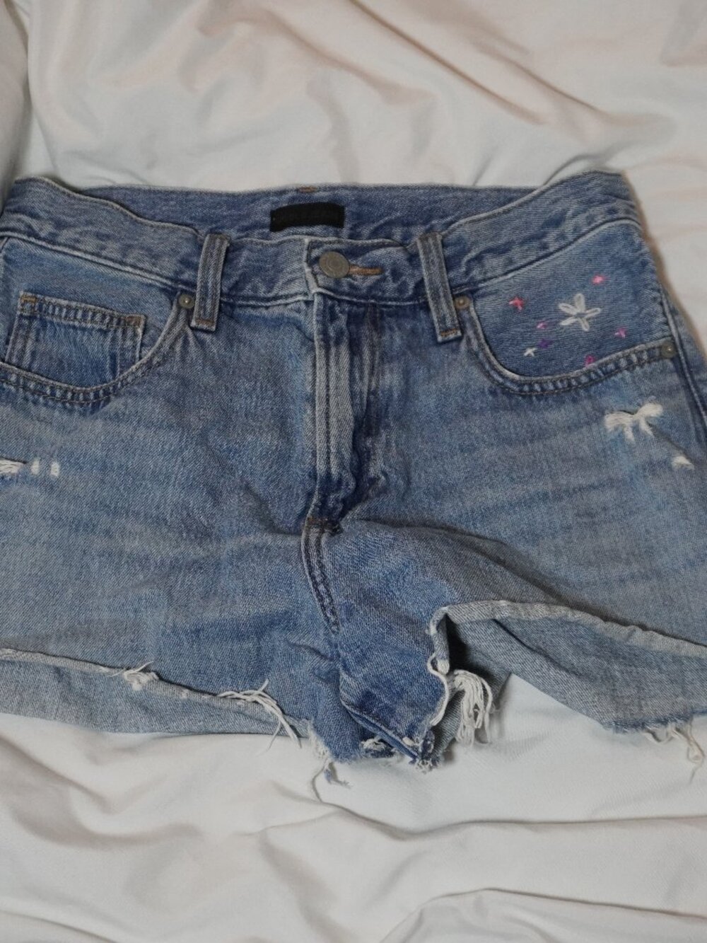 uniqlo denim shorts with embroidered flower detail